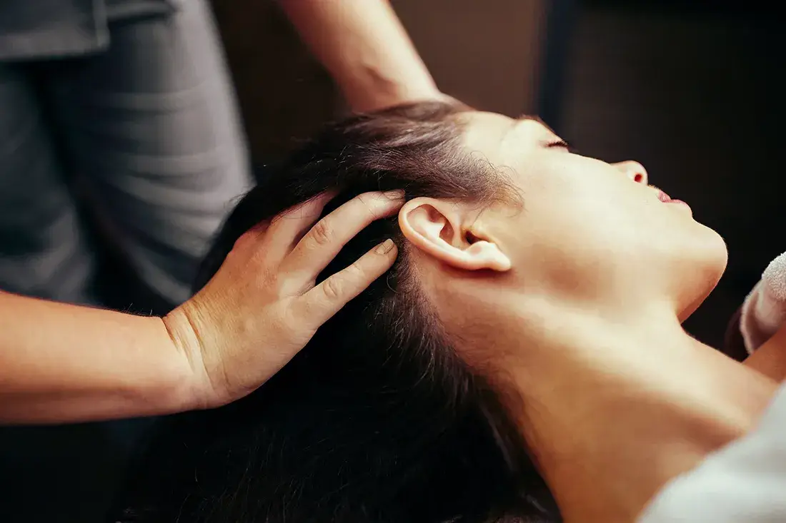 Hands-on massage of the face and jaw area
